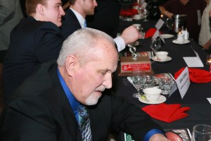 Former Nebraska Offensive Line Coach Milt Tenopir, recipient of the inaugural Tom Osborne Legacy Award for contributions to line play, signs autographs at the Outland Trophy presentation banquet on Jan. 15 in Omaha.