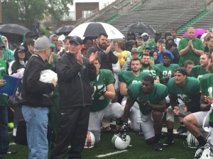 Marshall Coach Doc Holliday and the Herd football team showed their appreciation to Jack Bogaczyk for his coverage on a rainy April Saturday to cap 2016 spring practice.