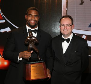 Alabama defensive end Jonathan Allen, winner of the 2016 Bronko Nagurski Trophy, poses with 2016 FWAA President Mark Anderson.