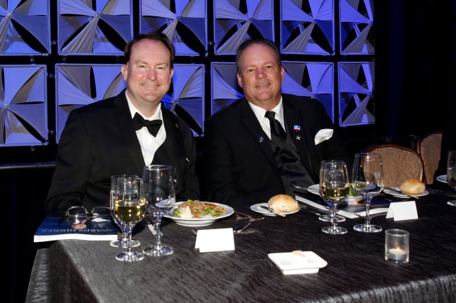 Mark Anderson (left) sits on the dais at the National Football Foundation Dinner on Dec. 6 in New York. FWAA member Ed Grom of the American Sports Network is seated beside Mark. (Photo Courtesy of the NFF)